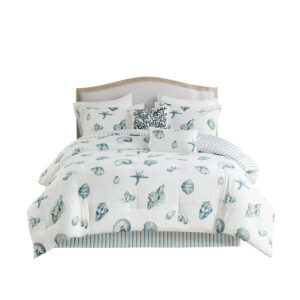 casual Beach House bedding collection from Harbor House. The comforter features a shell pattern that is printed in shades of blue onto a white