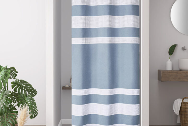 Update your space with the Madison Park Spa Waffle Shower Curtain with 3M Treatment. Featuring a fresh and updated stripe design