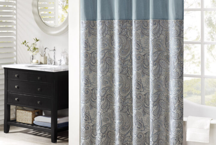 The Madison Park Aubrey Polyester Jacquard Shower Curtain creates a sophisticated modern look in your bathroom. The pieced design flaunts a beautiful woven jacquard in an updated paisley motif with a large solid stripe at the top of the shower curtain. This jacquard shower curtain is machine washable for easy care. Complete the collection and look with coordinate bath towels