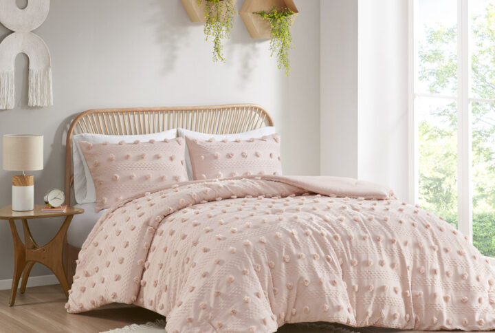 Refresh your bedroom with the elegant style of Intelligent Design's Lucy Clip Jacquard Comforter Set. This beautiful comforter features fun and playful clip jacquard pompoms all over the face that add dimension to the top of the bed for a lovely look. The matching shams (1 in Twin/TwinXL) also flaunt the delicate design of the comforter to complete the jacquard bedding set. Hypoallergenic polyester filling in the fashionable comforter contains no allergens and is treated to be dustproof. Machine washable for easy care