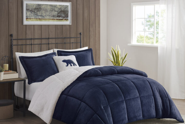 Bring the warmth and comfort of a cabin retreat to your bedroom with the Woolrich Alton Plush to Sherpa Down Alternative Comforter Set. Made from ultra-soft plush and reversing to a cozy berber