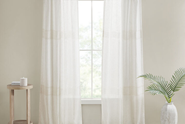 Create a soft and graceful allure in your home with the Madison Park Aida Yarn Dye Sheer Window Panel Pair. This sheer panel pair features a beautiful woven linen texture to create an airy look that drapes softly from your window; while handcrafted detailing creates a beautiful tonal color block pattern