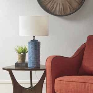 The INK+IVY Jayda Geometric Ceramic Table Lamp offers a sophisticated modern touch to your living room decor. This table lamp features a cylinder-shaped