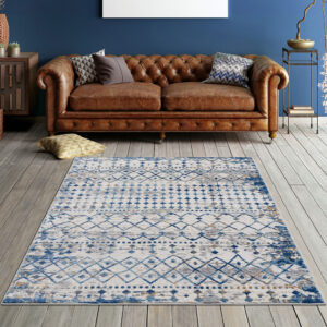 cut area rug features a blue and cream globally inspired print creating a rich and beautiful