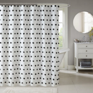 Add a fun update to your space with the Madison Park Sophie shower curtain. The solid white background features rows of soft black fabric pom poms