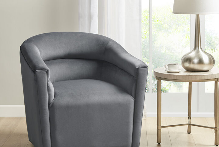 The Ryker Swivel Chair by Madison Park offers a luxurious blend of comfort and style to update your living room. This swivel chair features a round back and armrests with a horizontal channel that adds dimension to the transitional design. The soft