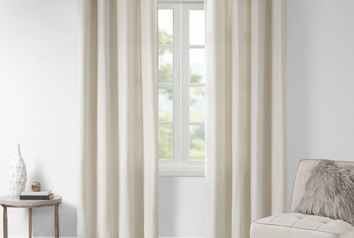 The Madison Park Englewood Solid Piece Dyed Grommet Top Window Panel brings a soft and modern touch to your home decor. This solid natural piece dyed window panel features a light heathered effect