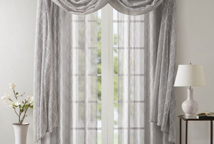 adding grace and charm to your décor. The neutral colors and light fabric helps create a delicate look to soften any room. Perfect on it's own as a beautiful drape to frame any window