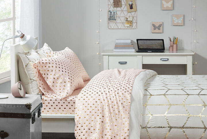 Add a touch of glam to your bedroom with the Intelligent Design Metallic Dot Printed Sheet Set. A metallic Ikat-style dot print is brilliantly displayed on the soft-hued fabric for a stunning modern look. Made from ultra-soft microfiber