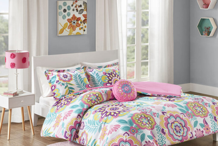 Brighten your bedroom with the fun and colorful style of the Mi Zone Camille Floral Comforter Set. The bright comforter and shams (1 in Twin/TwinXL) features a vibrant medallion flower print with a solid pink reverse