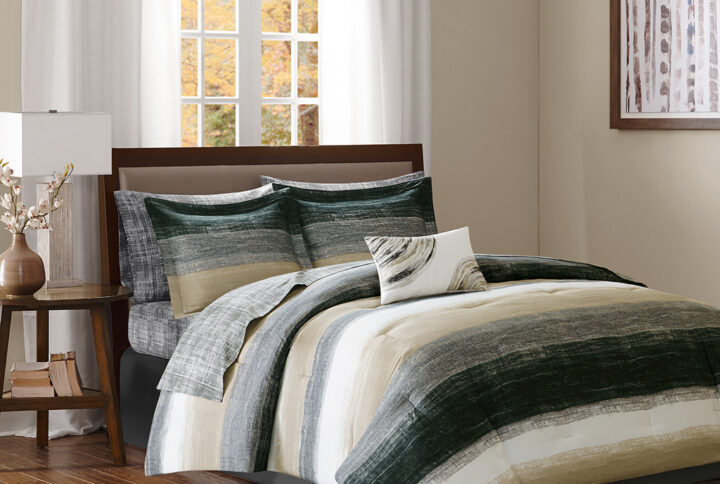 The Madison Park Essentials Saben Complete Comforter and Cotton Sheet Set provides a modern update to your bedroom. A watercolor stripe print is beautifully displayed on the ultra-soft microfiber comforter. The matching shams (1 in Twin Sizes) mirror the pattern of the comforter