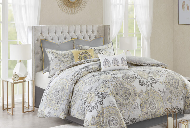 Refresh your bedroom with the Madison Park Isla 8 Piece Cotton Printed Reversible Comforter Set. The 100% cotton comforter and shams flaunt a botanical floral design with a medallion motif printed in soft watercolor hues. A printed pattern on the reverse complements the top of the bed. Two solid Euro shams and a solid bed skirt add a rich touch of color to the bedding set