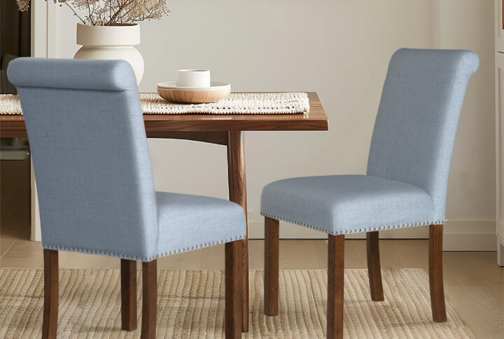 Embrace timeless elegance with the Aubrey Dining Chair Set from 510 Design. These chairs feature a transitional style