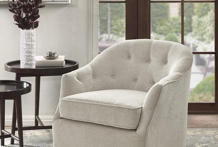 Classic meets contemporary with the Madison Park Calvin Swivel Chair. Upholstered in a soft natural-hued fabric