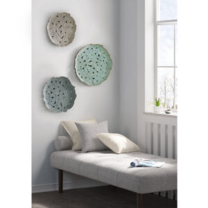 this wall decor set offers a splash of color to any room. The feather cutout design is made of a 100% metal material and features attached hook rings on each piece to easily mount on your wall. Available in a set of three