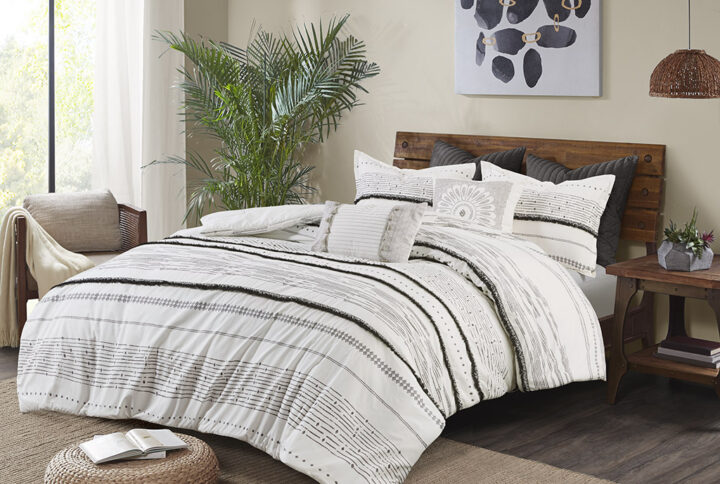 Give your bedroom a shabby chic update with the INK+IVY Cotton Printed Comforter Set with Trims. The 100% cotton comforter features a black stripe print with 6 rows of cotton tufted trims that add dimension to the charming boho look. Hidden bar tacks on the top of the comforter create a clean