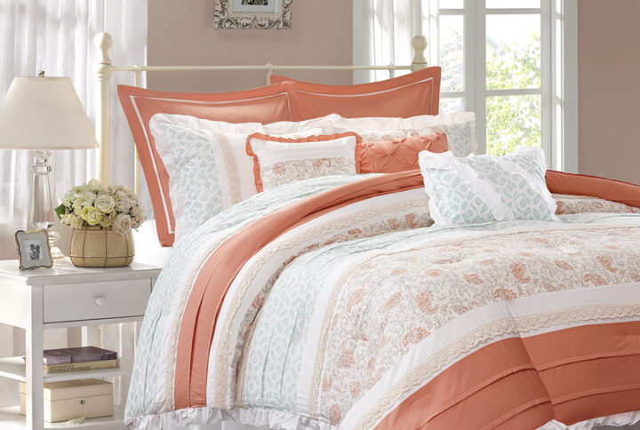 The Madison Park Dawn 9 Piece Cotton Percale Comforter Set offers a shabby chic update to your bedroom decor. A paisley print is featured on the cotton comforter with pintucked fabric separated by lace taping embellishments. Around the edge