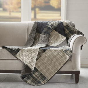 The Woolrich Winter Hills quilted throw features a a mix and match of plaids and solids. Made from 100% cotton this lightweight throw is soft to the touch and can be used year round.