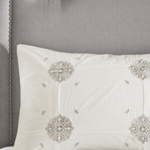 while the reverse showcases an all-over grey medallion print that complements the top of the bed. Two matching shams mirror the face of the cotton comforter and two grey Euro shams match the reverse of the comforter. An embroidered medallion design on the square decorative pillow provides an elegant finishing touch to the cotton comforter set. Machine washable for easy care