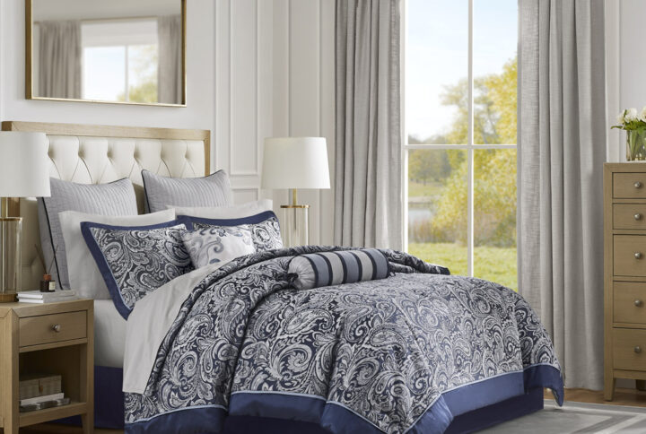 Give your bedroom a classic and elegant look with the Madison Park Aubrey 12 Piece Complete Bed Set including cotton bed sheets. This stunning set features a jacquard weave with a modern paisley pattern in a deep navy