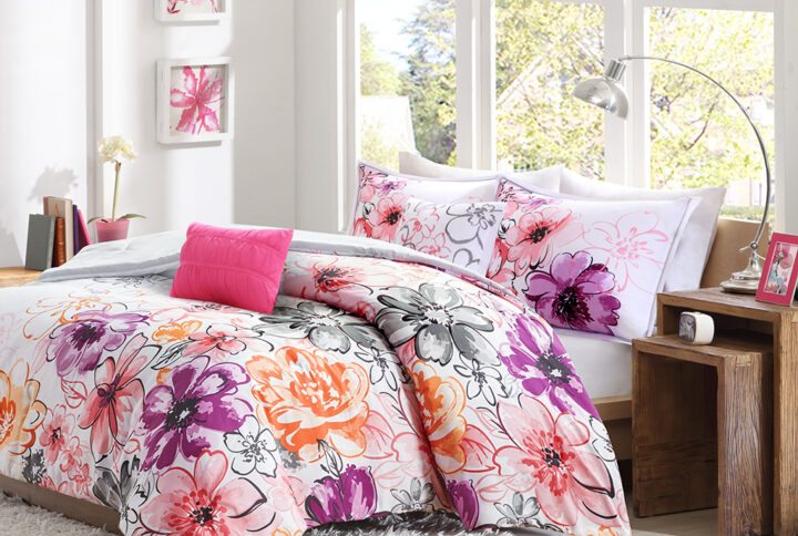 Bring a bright and cheerful update to your bedroom with the Intelligent Design Olivia Comforter Set. The comforter and shams (1 in Twin/TwinXL) flaunts bright colors and an asymmetrical floral print to invigorate your space with striking style. A solid grey reverse complements the top of the bed. The 2 decorative pillows feature floral embroidery and fabric manipulation