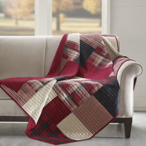 The Woolrich Sunset quilted throw features a a mix and match of plaids and solids and reverses to a solid red color. Made from 100% cotton this lightweight throw is soft to the touch and can be used year round.