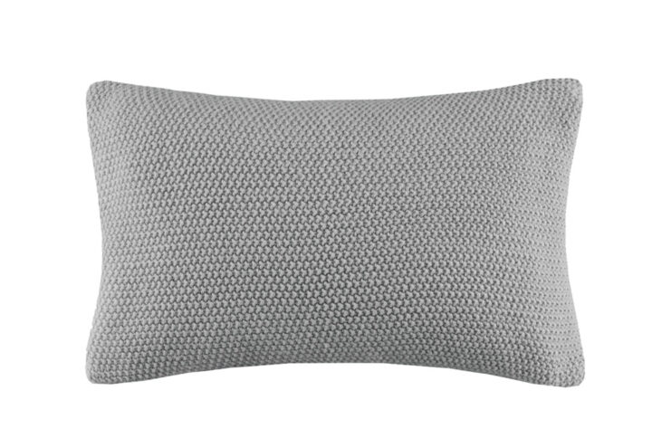 The INK+IVY Bree Knit Oblong Pillow Cover offers a simple and cozy addition to your living room or bedroom decor. This knit pillow cover is made from ultra-soft acrylic to create a casual cottage look. A hidden zipper closure provides a clean finished edge to the design. Machine washable for easy care