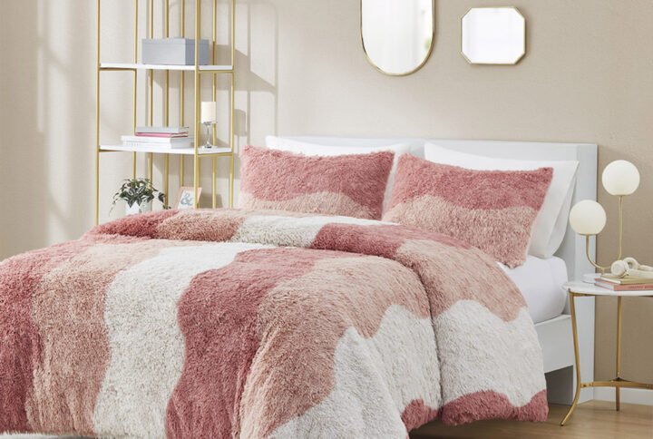 The Cassie shaggy faux fur comforter set showcases a unique