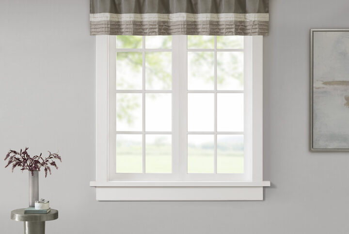 Madison Park Amherst Polyoni Pintuck Window Valance is a simple way to add style to your room. This window valance features a modern striped design in natural hues of ivory