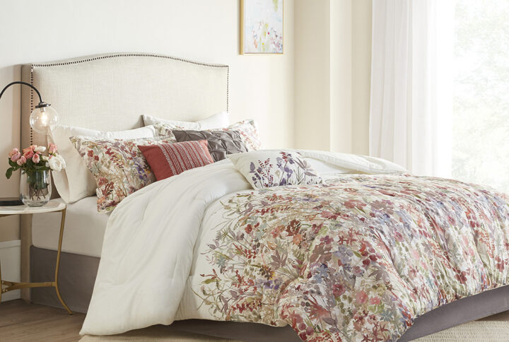 The Madison Park Mariana 7 Piece Cotton Printed Comforter Set brings a touch of beauty to your bedroom decor. This cotton comforter features a watercolor floral print that runs from the middle of the bed to the foot