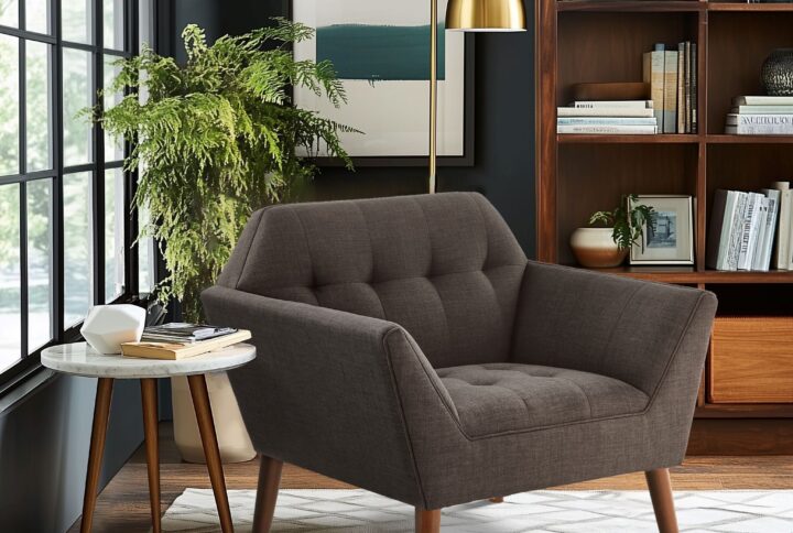 Elevate your living area with the mid-century allure of the INK+IVY Newport Upholstered Armchair. Featuring a wide 37-inch profile and a striking angular silhouette