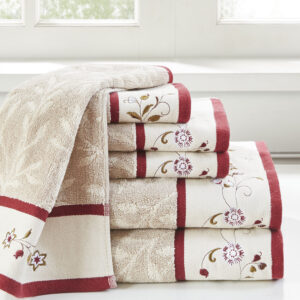 Add a touch of elegance to your bathroom decor with our Madison Park Serene Embroidered Cotton Jacquard 6 Piece Towel Set. These cotton towels feature a jacquard leaf pattern with a floral embroidered hem