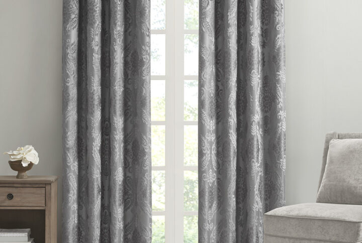 Our SunSmart Amelia Knitted Jacquard Paisley Total Blackout Grommet Top Curtain Panel adds the perfect touch of traditional elegance to your home. This total blackout grey curtain features an intricate paisley design on a heavy textured jacquard fabric