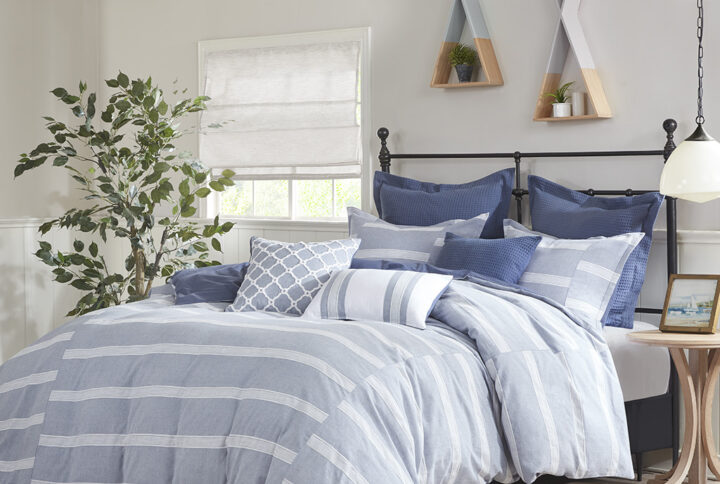 The Madison Park Signature Noble 9 Piece Cotton Comforter Set perfectly blends causal and elegant style to elevate your bedroom. This cotton comforter showcases a woven blue and white stripe pieced design to create an elegant farmhouse look. The cotton weave provides a subtle