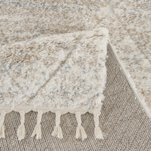 plush rug features a super soft high pile with a cream diamond trellis pattern for a modern and stylish update. Tassel detailing adds rich texture and an artisan touch