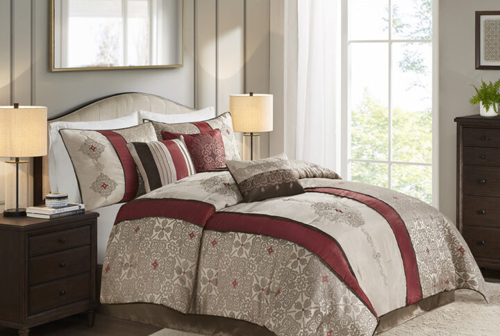 Donovan is an elegant update to your bedroom. This red comforter features a modern color blocked look with embroidered taupe details. The bold red stripes draw your eye into this beautiful comforter. Three decorative pillows further accentuate the colors and embroidered details in this collection. Also includes two king shams which pull the whole look together. The comforter is made from 100% polyester and is machine washable for easy care. Items in the set may come in a rolled or compressed packaging