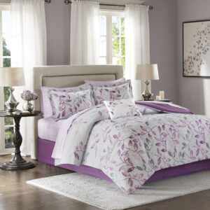 The Madison Park Essentials Lafael Complete Comforter and Cotton Sheet Set offers a charming update for your bedroom. The grey comforter showcases purple and dark grey leaves with a solid purple reverse