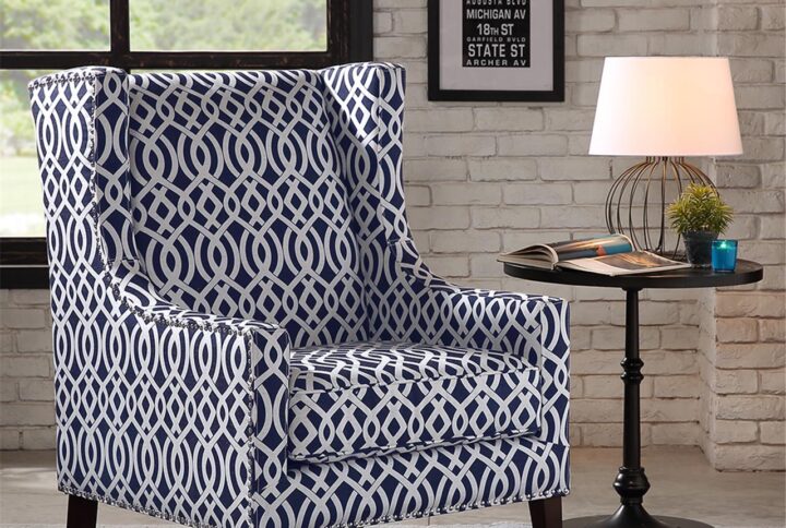 A wing back chair like this is a classic chair. Combining an updated print fabric with contrasting silver nail head