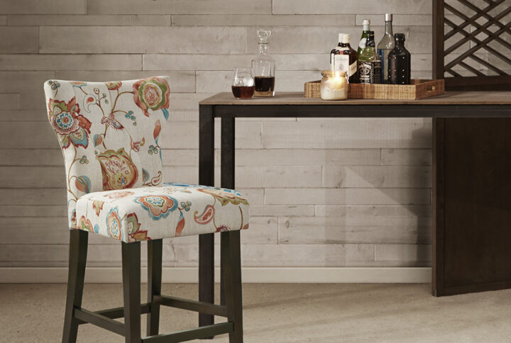 Change up your kitchen decor with the stunning style of the Madison Park Avila Tufted Back Counter Stool. This counter stool features a high button-tufted back upholstered in a light fabric with a multi-hued floral print