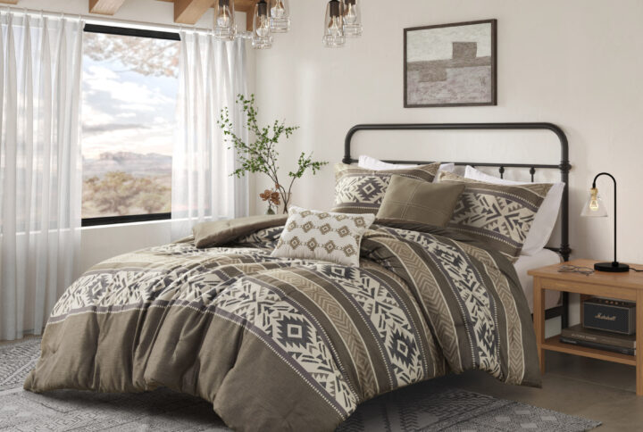 Spice up the bedroom with this southwestern-insprired comforter set featuring stipes with bold geometric patterns in hues of brown