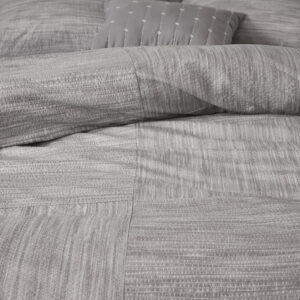 textured printed seersucker weave design for a updated transitional allure. Two matching shams repeat the style of the comforter