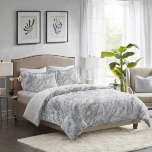 Feel the warmth and comfort when you slide into bed with the Madison Park Lana Long Faux Fur Comforter Set. This long faux fur comforter and shams feature a grey and blue marble pattern on a white base