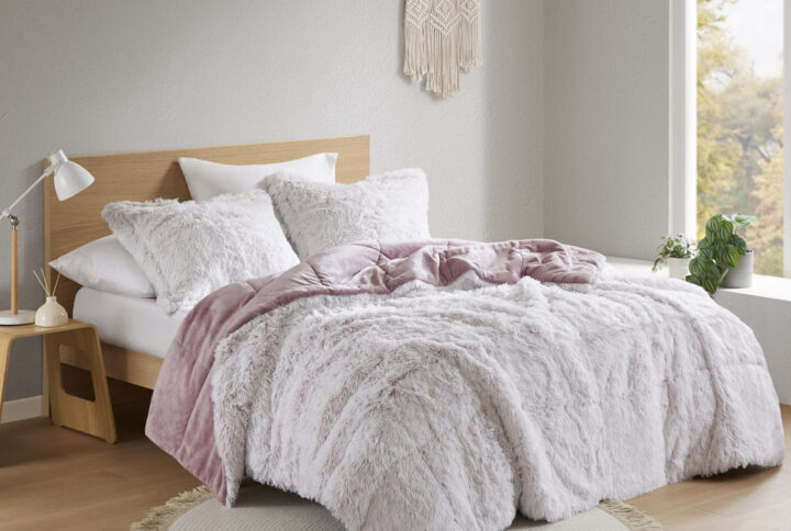 The Intelligent Design Malea Shaggy Long Fur Comforter Mini Set brings a soft contemporary update to your bedroom. The comforter and shams (1 in Twin/TwinXL) feature stylish shaggy faux fur that creates a soft fluffy texture and modern look. The solid plush reverse adds a soft and warm touch. Items in the set may come in a rolled or compressed packaging