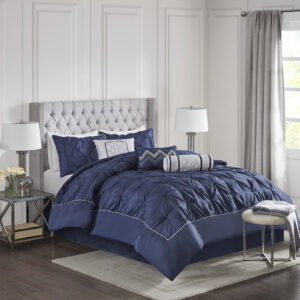 This beautifully tufted bed is from the Laurel bedding collection. Its deep navy coloring makes this set create a statement in your bedroom. The collection is made from 100% polyester polyoni and has pieced fabric sewn together to give this set dimension. It is finished with a smooth edge of fabric that creates a beautiful border around this comforter. Items in the set may come in a rolled or compressed packaging