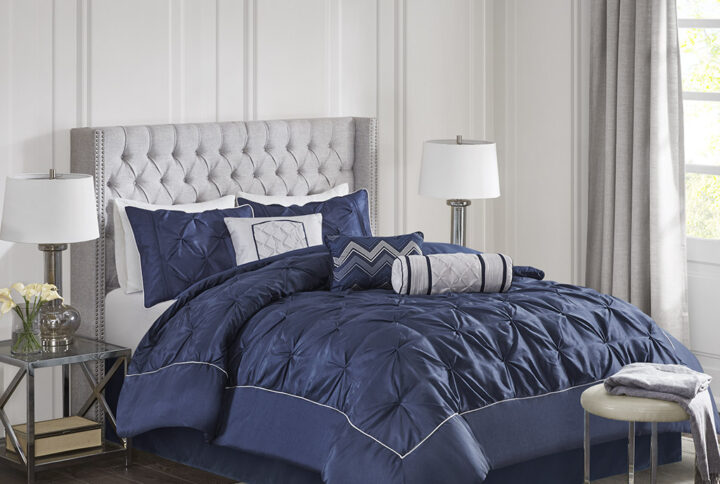 This beautifully tufted bed is from the Laurel bedding collection. Its deep navy coloring makes this set create a statement in your bedroom. The collection is made from 100% polyester polyoni and has pieced fabric sewn together to give this set dimension. It is finished with a smooth edge of fabric that creates a beautiful border around this comforter. Items in the set may come in a rolled or compressed packaging