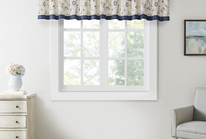 Add simple elegance to any room with the Serene window valance. The deep navy color combined with soft ivory and chocolate brown creates the perfect classic look. The valance features delicate floral embroidery and lining to help filter light and provide some room darkening features. Valance is made with 3" rod pocket and fits up to 1.25" diameter rod.