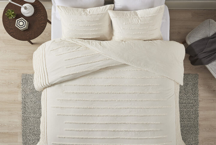 The Urban Habitat Mercer 3 Piece Cotton Chenille Comforter Set offers a cozy contemporary update to your bedroom decor. This cotton comforter features vertical chenille stripes along the sides and horizontal chenille stripes that run down the center to create a modern