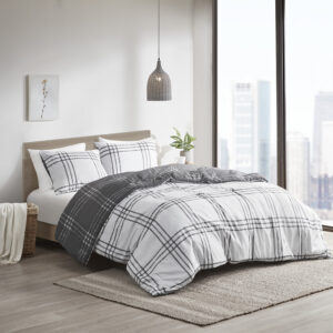 The Intelligent Design Pike Plaid Reversible Comforter Set offers a simple