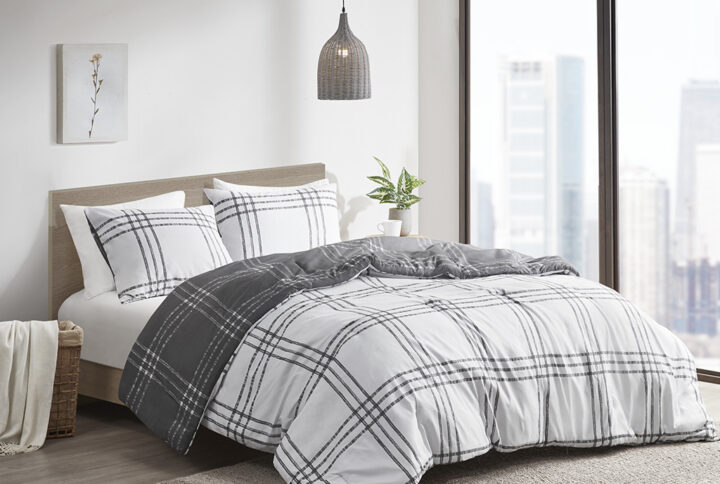 The Intelligent Design Pike Plaid Reversible Comforter Set offers a simple