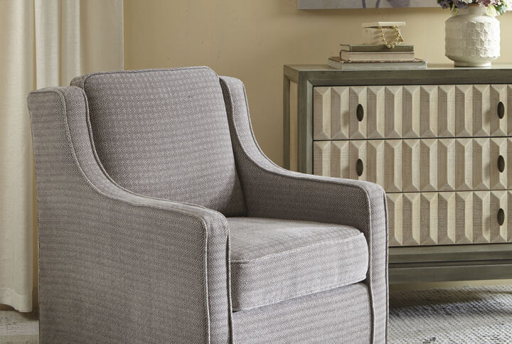 The Madison Park Harris Swivel Chair perfectly brings classic and contemporary together. Curved arms create a subtle wingback look